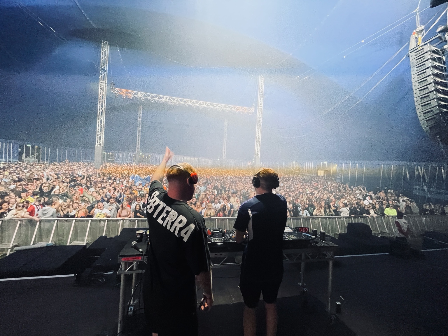 KIMMIC performing in front of a packed festival tent